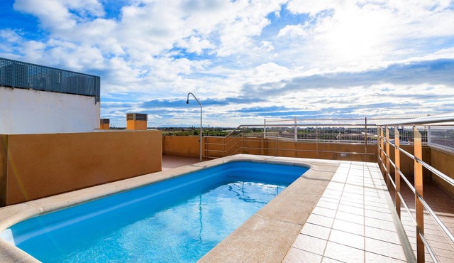 Bright and cozy apartment with shared pool and sea view.