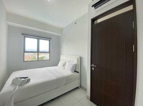 Bright and Relaxing 2BR Apartment at Mekarwangi Square Cibaduyut By Travelio