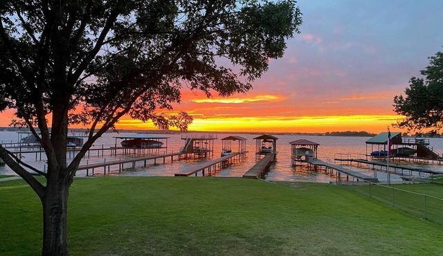 Bright, open concept, lakefront house on open water with amazing sunset views!