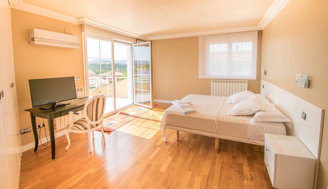 Bright private suite with king-size bed.