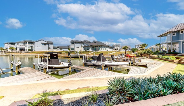 Bright waterfront villa with pool, boat slip, patio & balcony in gated community