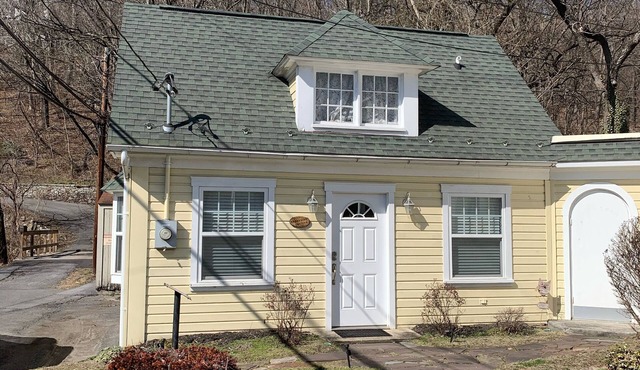Brookside Cottage is a beautiful open concept doll house stay for two.