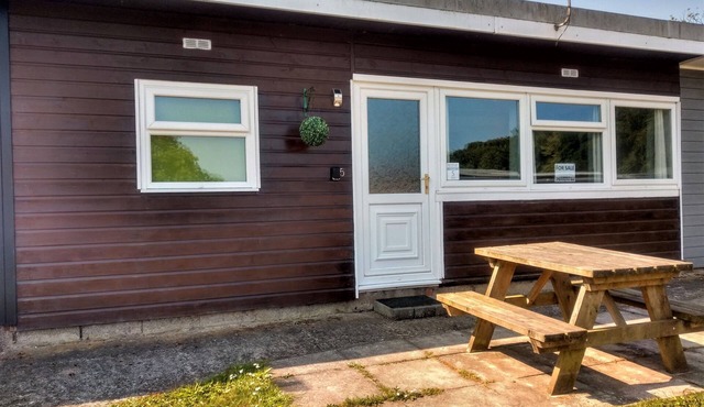 Buck's Cross Bideford Bay Devon chalet has own patio on maintained holiday park.