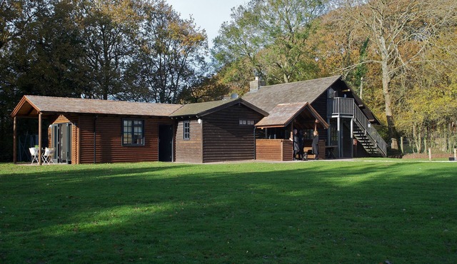 Buckstone Log Cabin with Private Grounds Nestled Into The Natural Woodland
