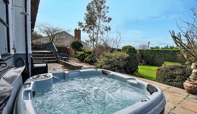 Bungalow in Dyserth with Hot Tub & Waterfall