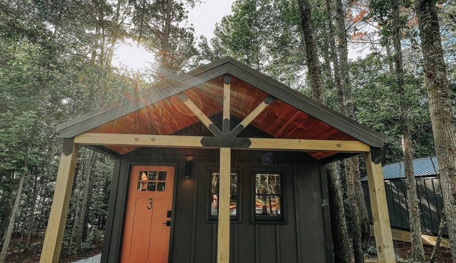 Cabin #3: One king-size bed, a full kitchen, and a large gravel parking pad beside the cabin for easy boat or trailer storage.