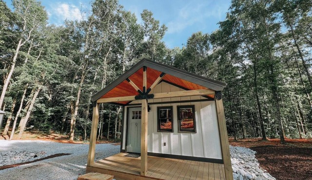Cabin #9: One king-size bed, a kitchenette, and a large gravel parking pad beside the cabin for easy boat or trailer storage.