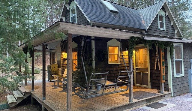 Cabin in the woods with wrap around porch