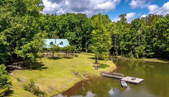 Cabin on 35 acres w/private lake for fishing, fenced yard, hot tub, pool table