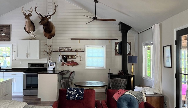 Cabin on secluded horse farm with stocked pond.