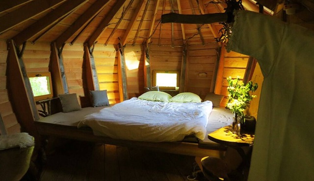 Cabin perched near a river, ideal for enjoying nature as a couple