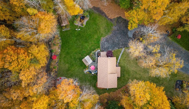 Cabin rental with Hot Tub, Fire Pit, mini fountain pond, hammocks, corn hole.