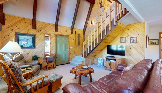 Cabin retreat with wrap-around porch, work spaces,