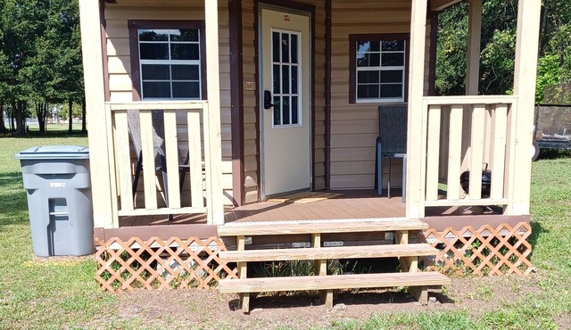 Cabins alongside Railroad Tracks