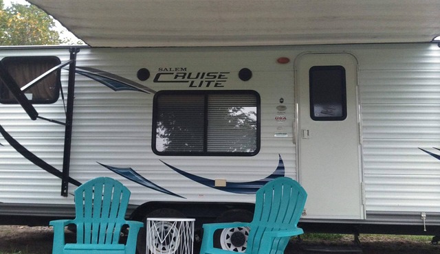 Camper near pool at Pebble Hill RV Resort