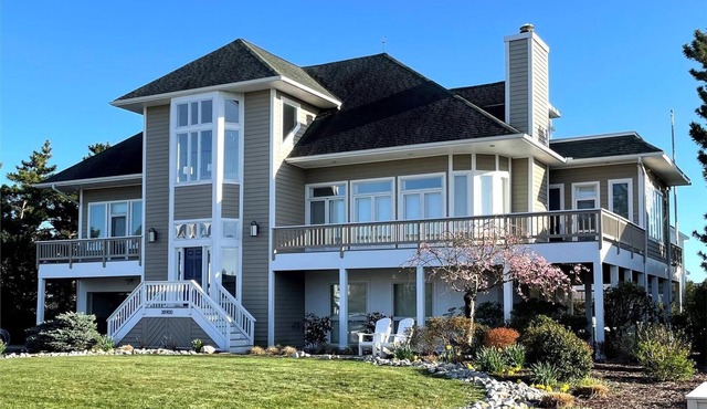 CANAL FRONT! Free Golf at Bear Trap Dunes and MORE! Exceptional, bright and spacious vacation home offers wonderful water views