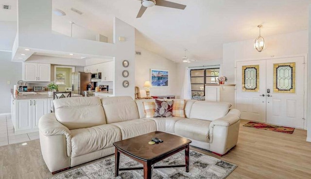 Canal-front home with sandy beaches, golf courses, dock, & refreshing pool