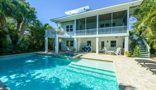 Canal front Home with Private Dock, Pool, Games, and Water Adventures