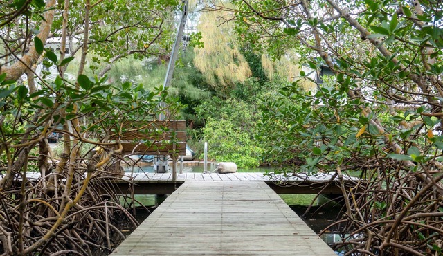 Canal-front home with a dock, GULF VIEWS, Shell Beach access.