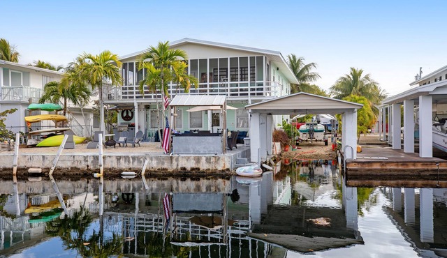 Canal-front Keys escape with amazing view, boat access, firepit, gril, AC, & W/D