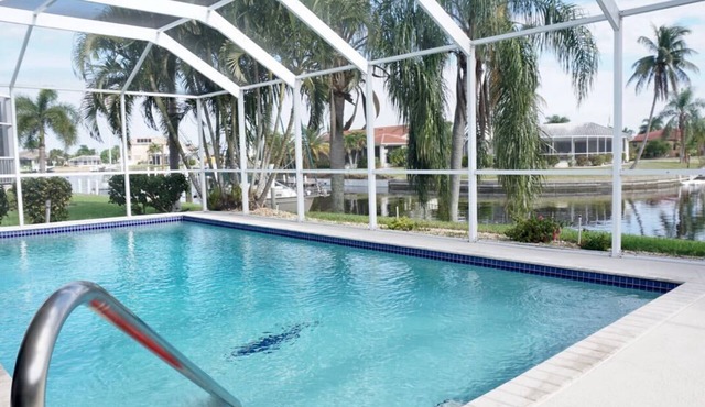 Canal home, best view, sunrise and sunset, huge HEATED salt pool, large dock