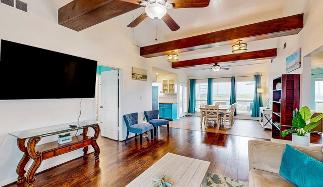Canal view retreat with vaulted ceilings & three-story observation deck