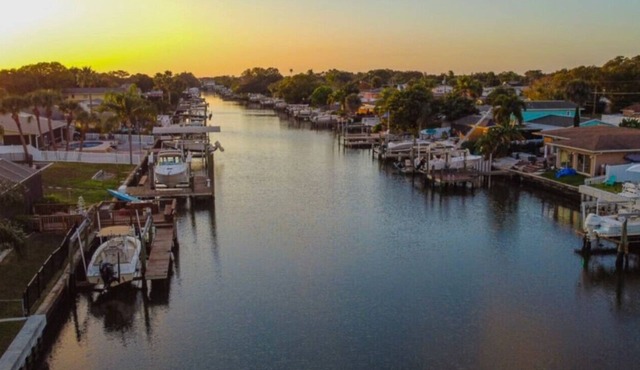 Canal views, dock, MANATEES, heated pool and more!