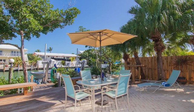 Canalfront Home + Cabana Club Access | Dock, Beach, Pool & Tiki Bar