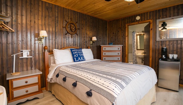 Captain’s Den is our executive blue toned all wooden room with a Captain’s flair