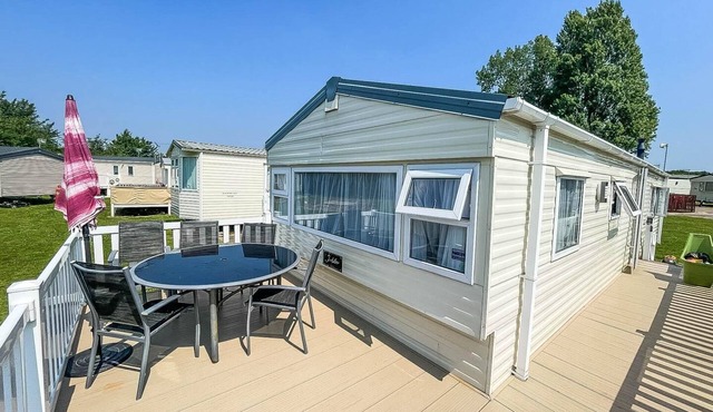 Caravan with large decking at Coopers Beach Holiday Park ref 49036TS