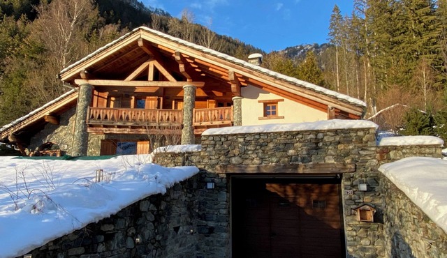 Catered 400sqm chalet with resident cook; luxury in wood and natural stone.