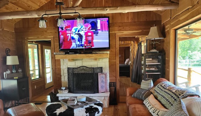 Cedar Acres offers a 3 Bedroom Log Cabin that overlooks a pond.