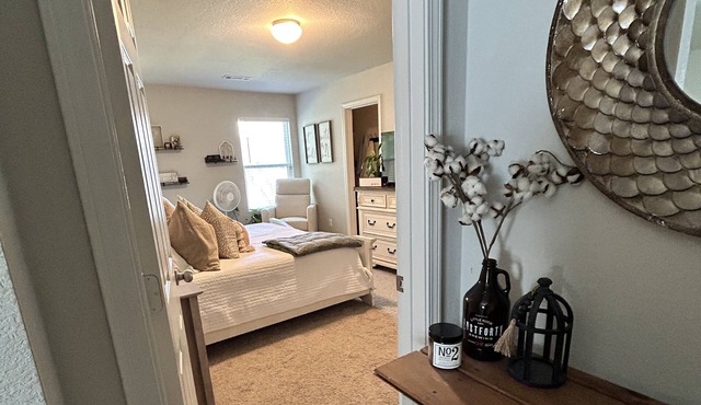 Centralized home in new neighborhood w/ fenced in yard, covered patio, & more!