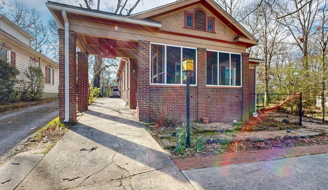 Centrally located retreat with a separate cottage, large yard, W/D, & central AC