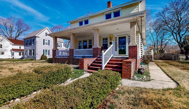 Century-old home with fenced yard, great front porch & small-town charm