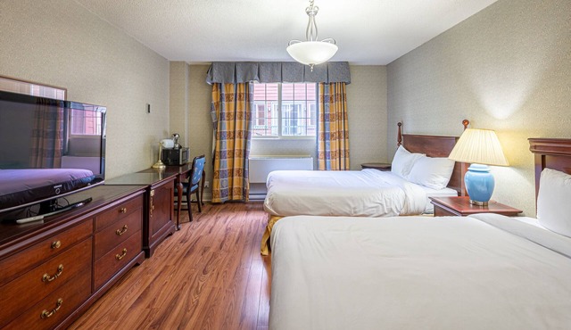 Chambre d'hotel le Cadillac 2 lits queen