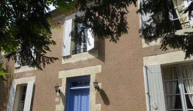 Character house overlooking wooded park in the heart of a village