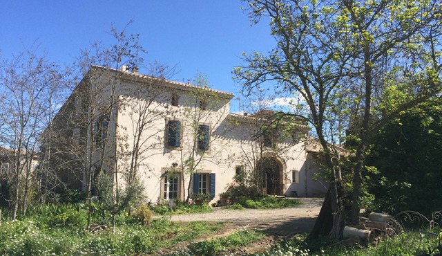 Character building on large wooded grounds with private garden.