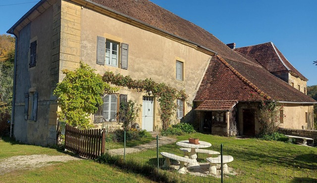 Character house with garden in a peaceful forest hamlet