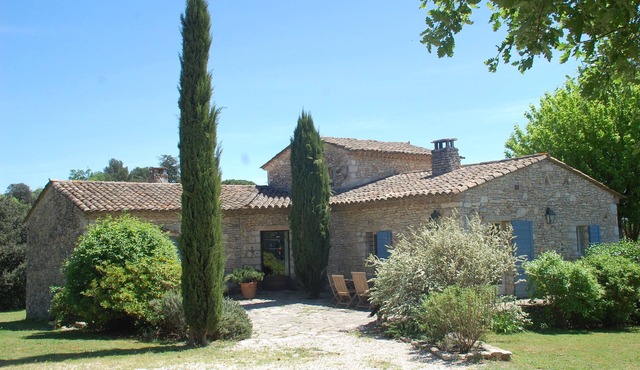 Character stone house with swimming pool surrounded by olive trees