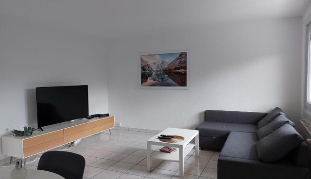 Charmant appartement au rez de jardin d'une maison