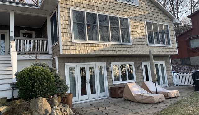 Charmer with lake views, hot tub, fire pit, and short walk to private beach.