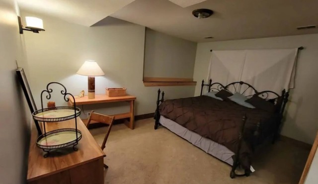Charming 2-bedroom apartment with outdoor hot tub in rural area, private yard.