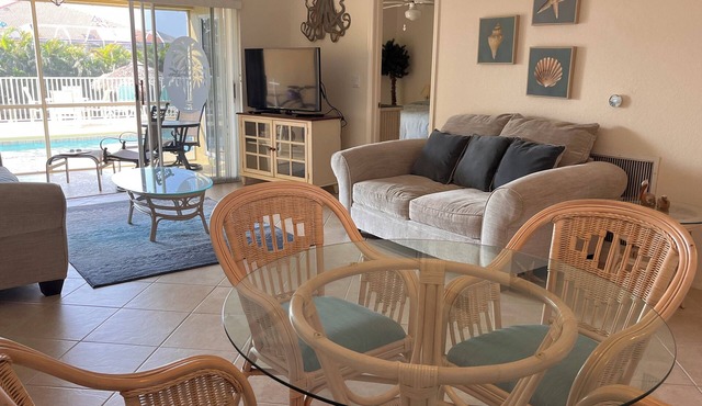 Charming 2-bedroom condo with WiFi, in Cape Coral with pool, spa, & water view.