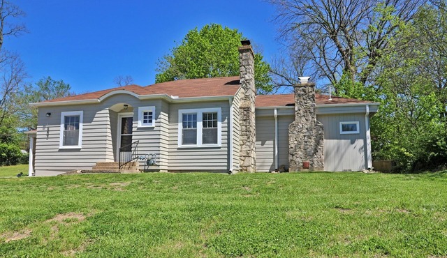 Charming 2-bedroom cottage in scenic Southwest MO with a large corner lot.