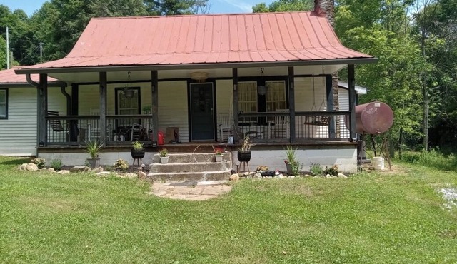 Charming 2-bedroom historic house set on 2 acres with a meandering stream.