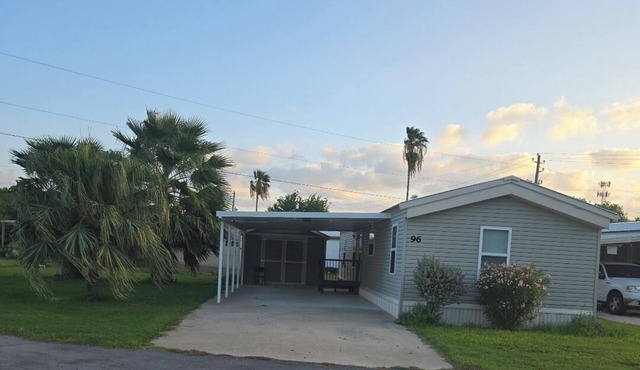 Charming 2-bedroom house in nice gated community with AC , shared swiming pool