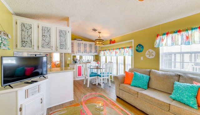 Charming 2-bedroom resort home minutes from the beaches with heated pools.