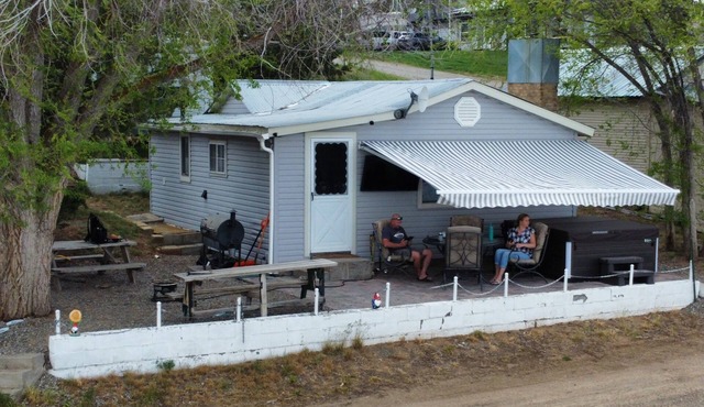Charming 2 bedroom waterfront cabin at West Magic Id. 83352 with hot tub.