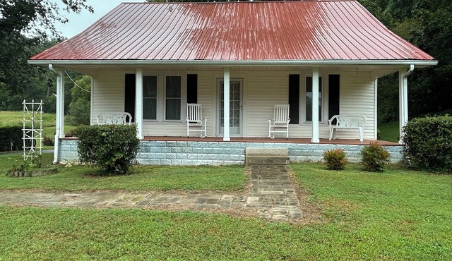Charming 3-bedroom farmhouse with 2 full baths in a quiet country setting.